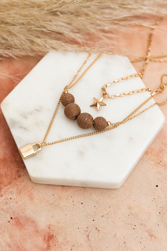 Three Layered Rustic Gold Charmed Necklace