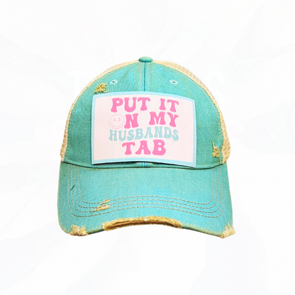 Put It On My Husband's Tab Trucker HAT