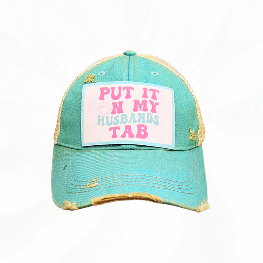 Put It On My Husband's Tab Trucker HAT